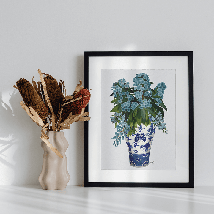 Blue Flowers In Butterfly Vase